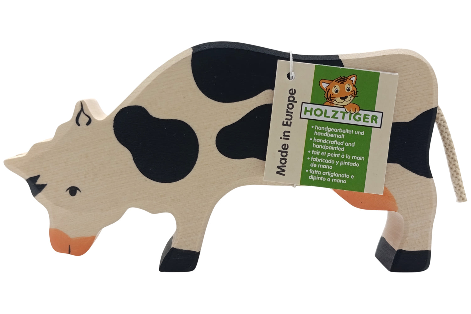 Holztiger Kuh grasend schwarz/weiß