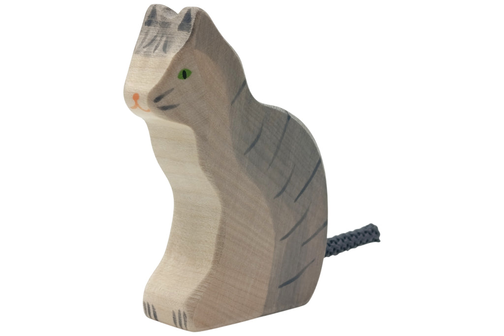 Holztiger Katze sitzend grau