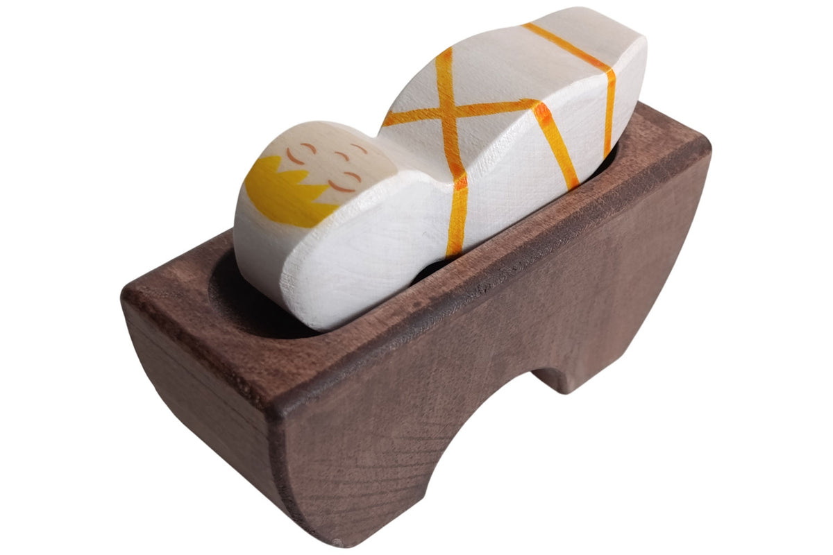 Holztiger Jesuskind 3 in der Krippe